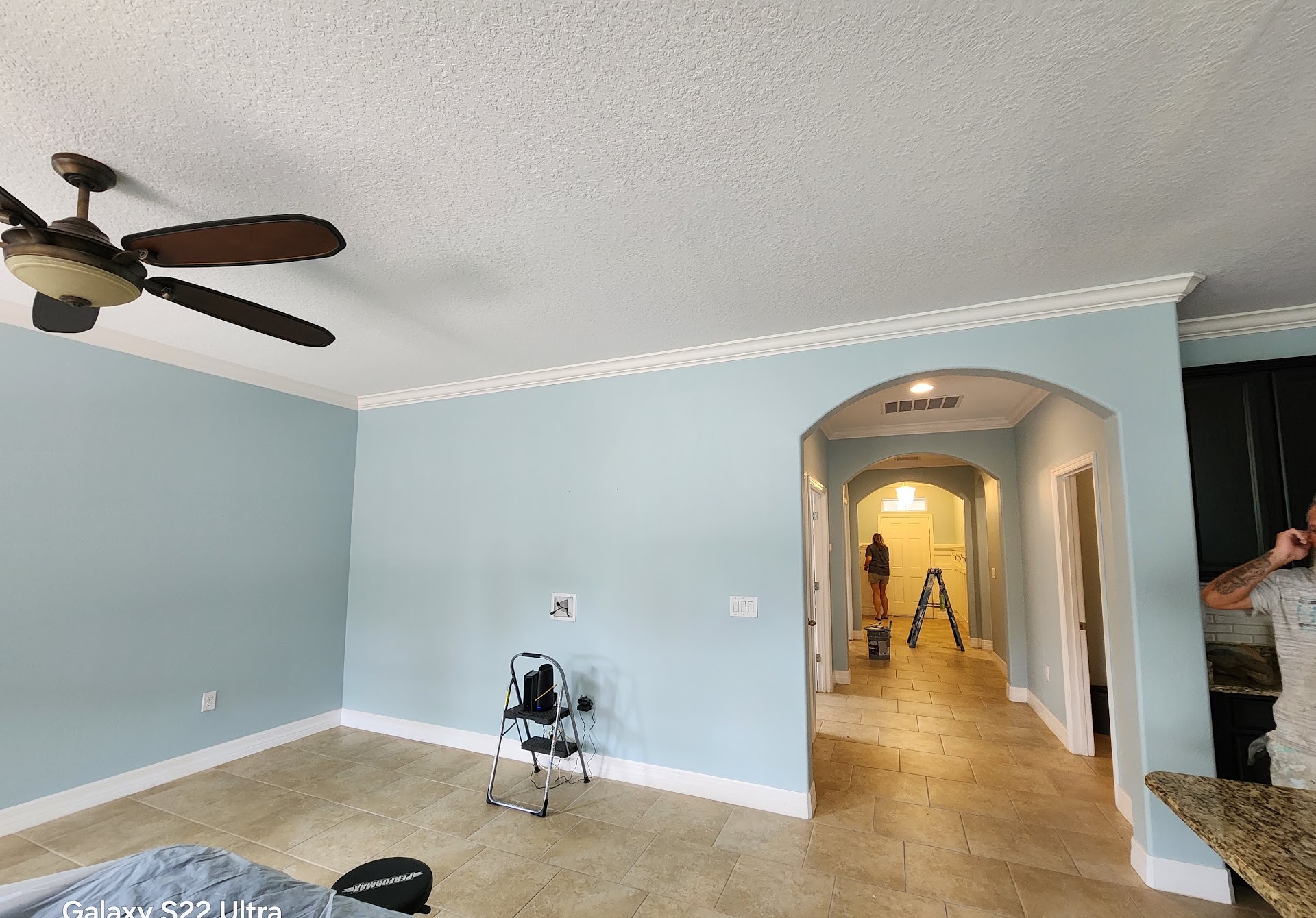 Freshly painted soft blue-green bedroom with white ceiling and crown molding